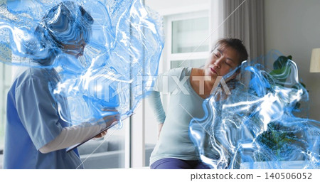 Sitting Korean woman holding back on bed at home, man in scrubs noting clipboard, blue overlay Sitting Korean woman holding back on bed at home, man in scrubs noting clipboard, blue overlay 140506052