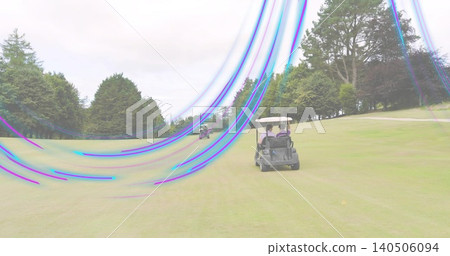 Driving two golfers in canopy cart along fairway, in polos, caps, purple-blue streaks, copy space Driving two golfers in canopy cart along fairway, in polos, caps, purple-blue streaks, copy space 140506094