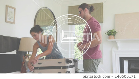 Packing couple loading beige hardshell suitcase on bed, woman in grey tank, handbag visible Packing couple loading beige hardshell suitcase on bed, woman in grey tank, handbag visible 140506171