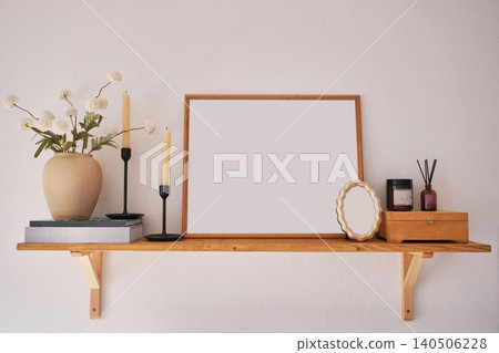 Elegant Shelf Decor Featuring a Neutral Vase, Candles, and a Framed Picture in a Minimalist Style Elegant Shelf Decor Featuring a Neutral Vase, Candles, and a Framed Picture in a Minimalist Style 140506228