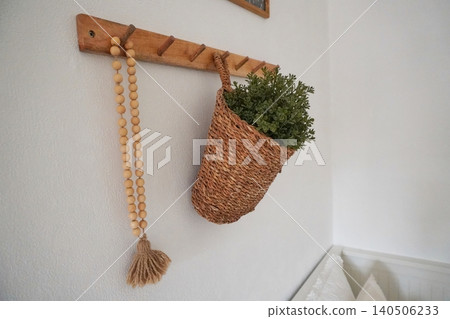 Beautifully Crafted Wall Hooks with Woven Basket and Greenery for Cozy Interior Decor 140506233