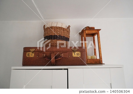 Decorative Shelves Featuring Vintage Suitcase, Woven Basket and Lantern for Cozy Home Aesthetic Decorative Shelves Featuring Vintage Suitcase, Woven Basket and Lantern for Cozy Home Aesthetic 140506304