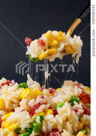 Fusion Fried Rice with Chinese Sausage, Corn, Green Peas and Melted Cheese. Creative Asian Stir-Fried Rice Bowl. Fusion Fried Rice with Chinese Sausage, Corn, Green Peas and Melted Cheese. Creative Asian Stir-Fried Rice Bowl. 140506335