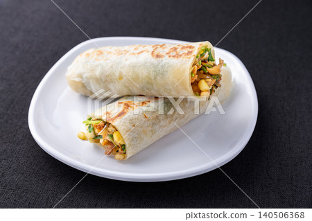 Savory Wheat Wrap Roll with Vegetables and Egg, Chinese Street Food Snack Savory Wheat Wrap Roll with Vegetables and Egg, Chinese Street Food Snack 140506368
