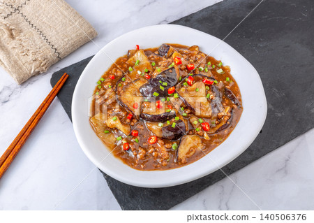Chinese Braised Eggplant with Minced Pork and Chili in Claypot. Savory Sichuan Style Stewed Eggplant, Asian Cuisine. Chinese Braised Eggplant with Minced Pork and Chili in Claypot. Savory Sichuan Style Stewed Eggplant, Asian Cuisine. 140506376