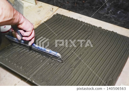 Crafting Textured Surface with Wet Cement Using Trowel for Construction and Artistic Purposes Crafting Textured Surface with Wet Cement Using Trowel for Construction and Artistic Purposes 140506563