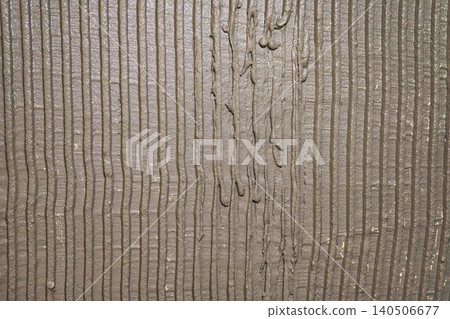 Textured Surface of Wet Cement with Vertical Grooves and Lines Highlighting Surface Design Elements 140506677