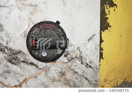 Vacuum Construction Suction Cup Mounted On Marble Walls With Characteristic Textures And Patterns Vacuum Construction Suction Cup Mounted On Marble Walls With Characteristic Textures And Patterns 140506735