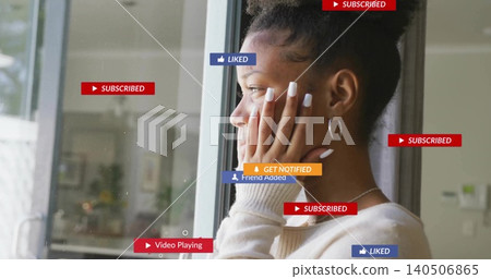 Standing woman resting face by glass door, wearing ribbed top and hoops, showing badges, copy space Standing woman resting face by glass door, wearing ribbed top and hoops, showing badges, copy space 140506865