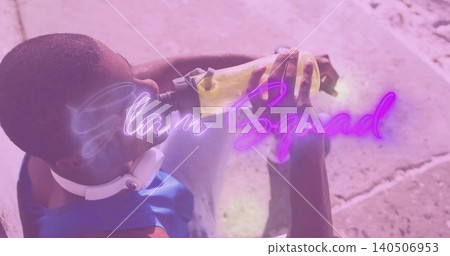 Drinking man tilting back holding bottle on concrete, blue top, phones, neon GlamSquad, copy space Drinking man tilting back holding bottle on concrete, blue top, phones, neon GlamSquad, copy space 140506953