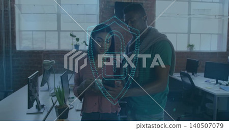 Woman in pink blouse and man in green tee checking smartphone in loft, with shield overlay Woman in pink blouse and man in green tee checking smartphone in loft, with shield overlay 140507079