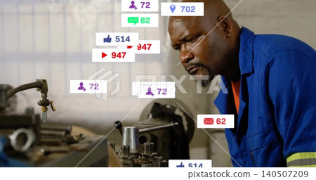 Leaning machinist wearing blue coveralls adjusting lathe at shop bench, showing HUD, copy space Leaning machinist wearing blue coveralls adjusting lathe at shop bench, showing HUD, copy space 140507209