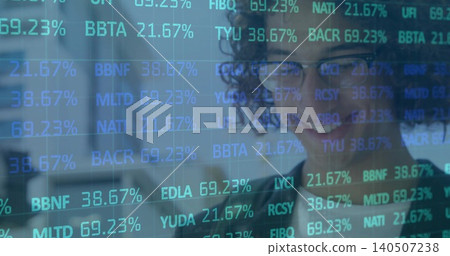 Analyzing data, analyst with glasses, blazer viewing office screen with ticker overlay, copy space Analyzing data, analyst with glasses, blazer viewing office screen with ticker overlay, copy space 140507238
