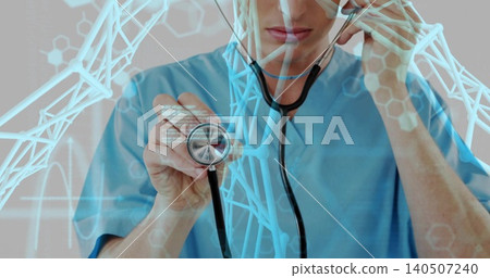 Showing doctor holding stethoscope in clinic, wearing blue scrubs with digital DNA helix overlays Showing doctor holding stethoscope in clinic, wearing blue scrubs with digital DNA helix overlays 140507240