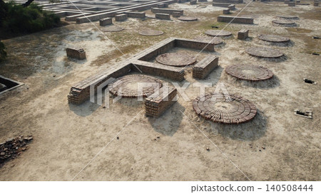 Harappa home ruins with round platforms where indigo dye and grain work happened Harappa home ruins with round platforms where indigo dye and grain work happened 140508444