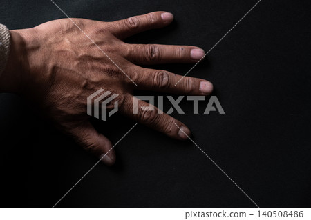 Hands on a black background 140508486
