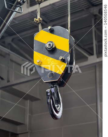 Heavy duty pulley system used in construction site for lifting and moving large loads safely Heavy duty pulley system used in construction site for lifting and moving large loads safely 140508546