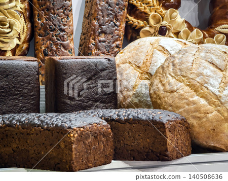 Freshly baked bread and pastries displayed in a bakery during a busy morning in a local market Freshly baked bread and pastries displayed in a bakery during a busy morning in a local market 140508636