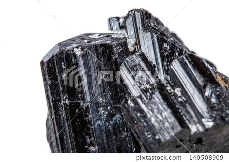 macro mineral stone sherle, schorl, black tourmaline on white background macro mineral stone sherle, schorl, black tourmaline on white background 140508909