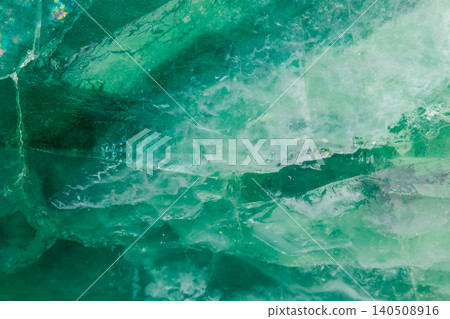 Macro mineral stone Fluorite crystal on a black background Macro mineral stone Fluorite crystal on a black background 140508916