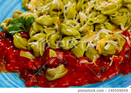 Appetizing tortellini with cheese and tomatoe sauce Appetizing tortellini with cheese and tomatoe sauce 140509049