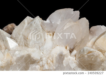 Macro mineral stone Snow quartz with calcite on a black background Macro mineral stone Snow quartz with calcite on a black background 140509227