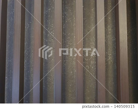 Wooden bars against a stone wall Wooden bars against a stone wall 140509315