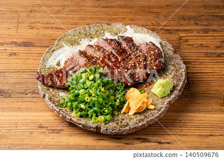 Juicy beef skirt steak grilled over charcoal for a delicious aroma. Juicy beef skirt steak grilled over charcoal for a delicious aroma. 140509676