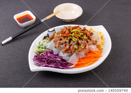 Chinese sheet jelly salad with shredded pork sauce and colorful vegetables, da la pi 140509740