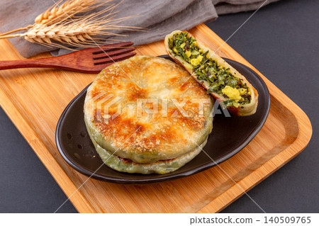 Traditional Chinese Shepherds Purse and Egg Stuffed Pancakes, Savory Flatbread Snack Traditional Chinese Shepherds Purse and Egg Stuffed Pancakes, Savory Flatbread Snack 140509765