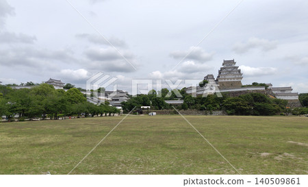A panoramic view of Himeji Castle soaring against the blue sky. A panoramic view of Himeji Castle soaring against the blue sky. 140509861