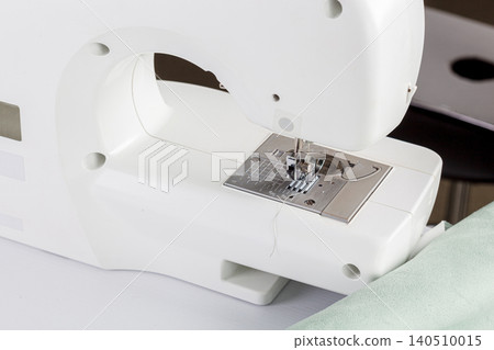 Sewing machine, stitching fabrics, needle in a round plan 140510015