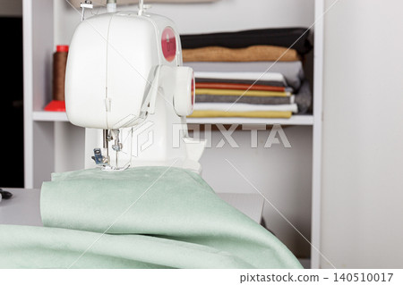 Sewing machine, stitching fabrics, needle in a round plan Sewing machine, stitching fabrics, needle in a round plan 140510017