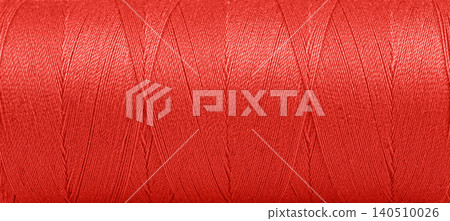 Texture of threads in a spool of red color on a white background Texture of threads in a spool of red color on a white background 140510026