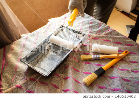 DIY roller with fresh paint. Tray, sleeve, extension pole. Affordable tools, big results. Developing handy skills. Smart budget move for cosmetic home repairs 140510408