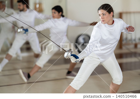 woman at fencing club against the background of athletes 140510466