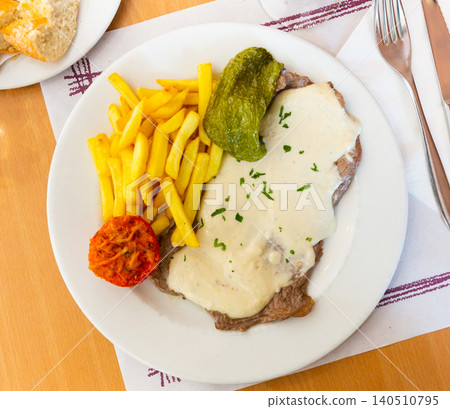 Appetizing beef steak with creamy Roquefort sauce Appetizing beef steak with creamy Roquefort sauce 140510795