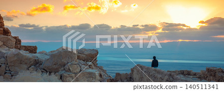 Beautiful sunrise over the Dead Sea. View from Masada fortress. Ruins of King Herod's palace in Judaean Desert Beautiful sunrise over the Dead Sea. View from Masada fortress. Ruins of King Herod's palace in Judaean Desert 140511341