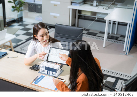 Considering buying a home, investing in real estate. Broker signs a sales agreement. agent, lease agreement, successful deal. Considering buying a home, investing in real estate. Broker signs a sales agreement. agent, lease agreement, successful deal. 140512402