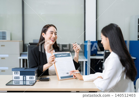 Considering buying a home, investing in real estate. Broker signs a sales agreement. agent, lease agreement, successful deal. Considering buying a home, investing in real estate. Broker signs a sales agreement. agent, lease agreement, successful deal. 140512403