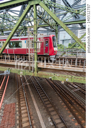 [Keikyu Main Line] Early morning local train passing over the Yatsuyama Bridge 140512787