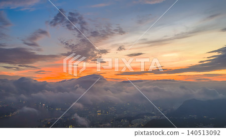 June 9 2022 HK. Golden Sunset Clouds Above Mountain Silhouettes June 9 2022 HK. Golden Sunset Clouds Above Mountain Silhouettes 140513092
