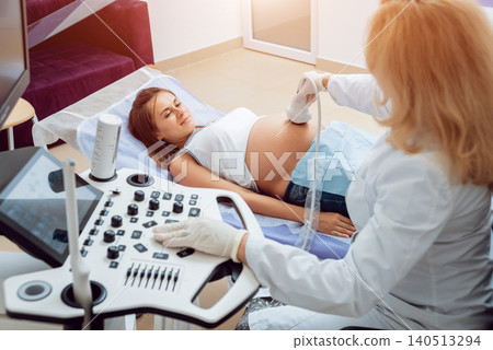 Professional doctor screening of pregnant woman by ultrasound. Fetal health monitoring Professional doctor screening of pregnant woman by ultrasound. Fetal health monitoring 140513294