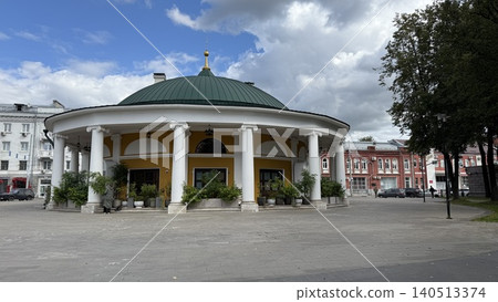 Round building with classical columns and green roof against cloudy sky, suitable for background Round building with classical columns and green roof against cloudy sky, suitable for background 140513374