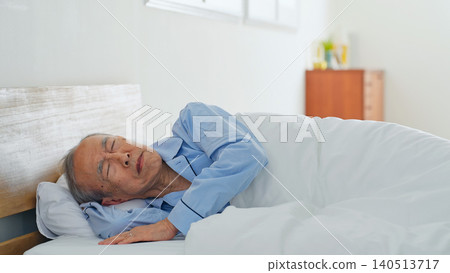 Senior man suffers from restless sleep and nightmares 140513717