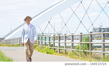 Senior man taking a walk outside Senior man taking a walk outside 140513724