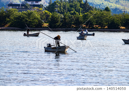 A scene of clam fishing on Lake Togo in the morning. A scene of clam fishing on Lake Togo in the morning. 140514050