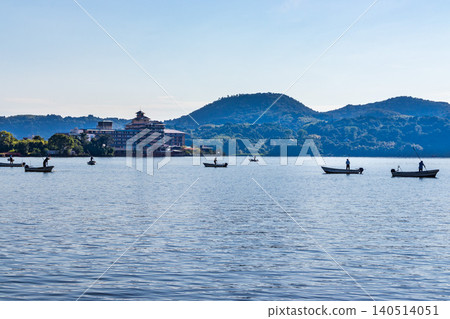 A scene of clam fishing on Lake Togo in the morning. A scene of clam fishing on Lake Togo in the morning. 140514051