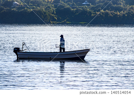 A scene of clam fishing on Lake Togo in the morning. A scene of clam fishing on Lake Togo in the morning. 140514054