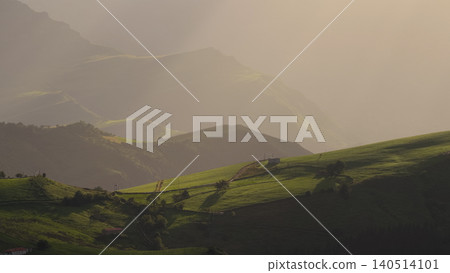 Cantabria mountains with green pastures and sunset mist Cantabria mountains with green pastures and sunset mist 140514101